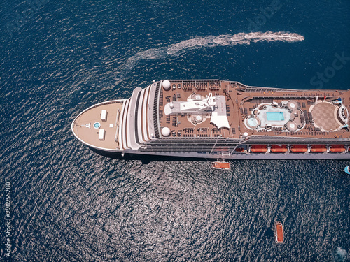 A large cruise liner viewed from the drone in the blue sea, deck, details  cruise vessel concept. © Semachkovsky 
