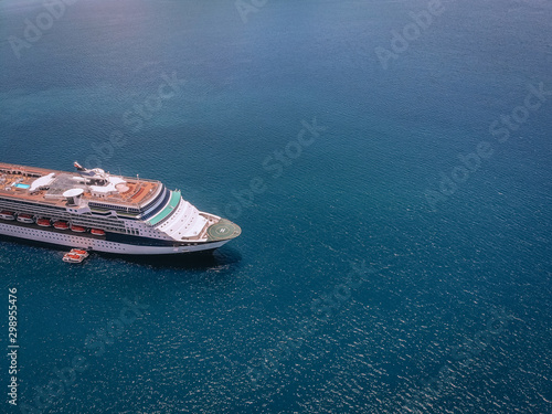 Top view of the beautiful cruise liner, boats around, near the seashore in the Andaman sea; recreation concept.