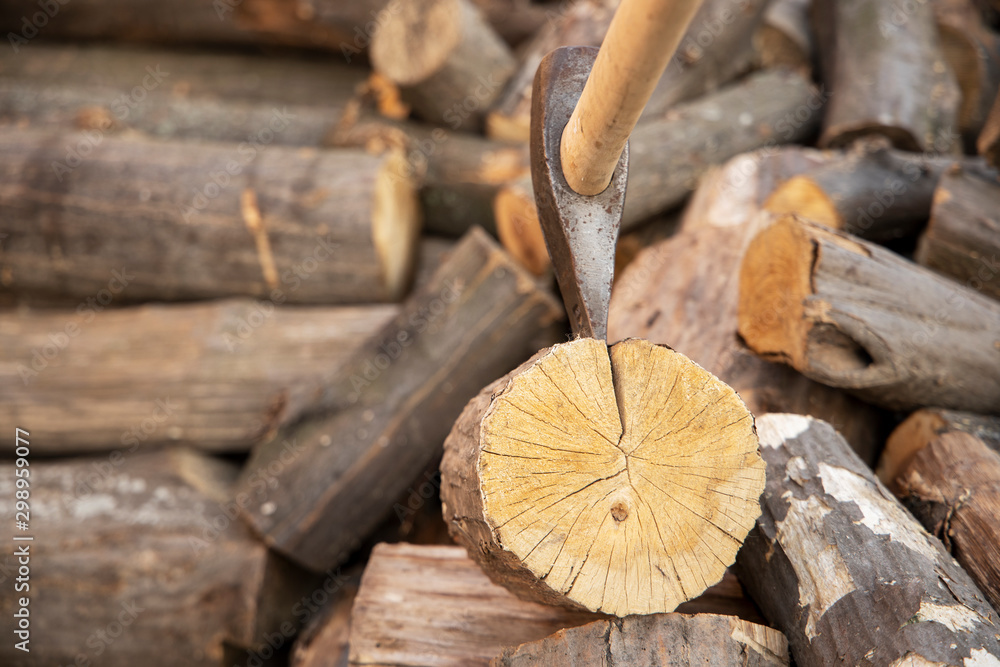 Ax stuck in the stump. wooden stump in the forest. Deforestation man. Felled tree. Woodcutter's ax on the stump. Ax stuck in the stump. wooden stump in the forest. Deforestation man. Felled tree. Woodcutter's ax on the stump.