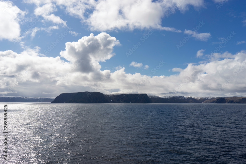 Coastline of the island Mageroya (Magerøya) in Norway, Europe in the Barents Sea. Mageroya belongs to the Nordkapp municipality and is the island where the North Cape is located. Coastline of the island Mageroya (Magerøya) in Norway, Europe in the Barents Sea. Mageroya belongs to the Nordkapp municipality and is the island where the North Cape is located.