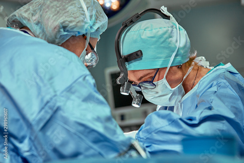 Portrait of a team of surgeons at work. During surgery. Concept medicine, saving lives.
