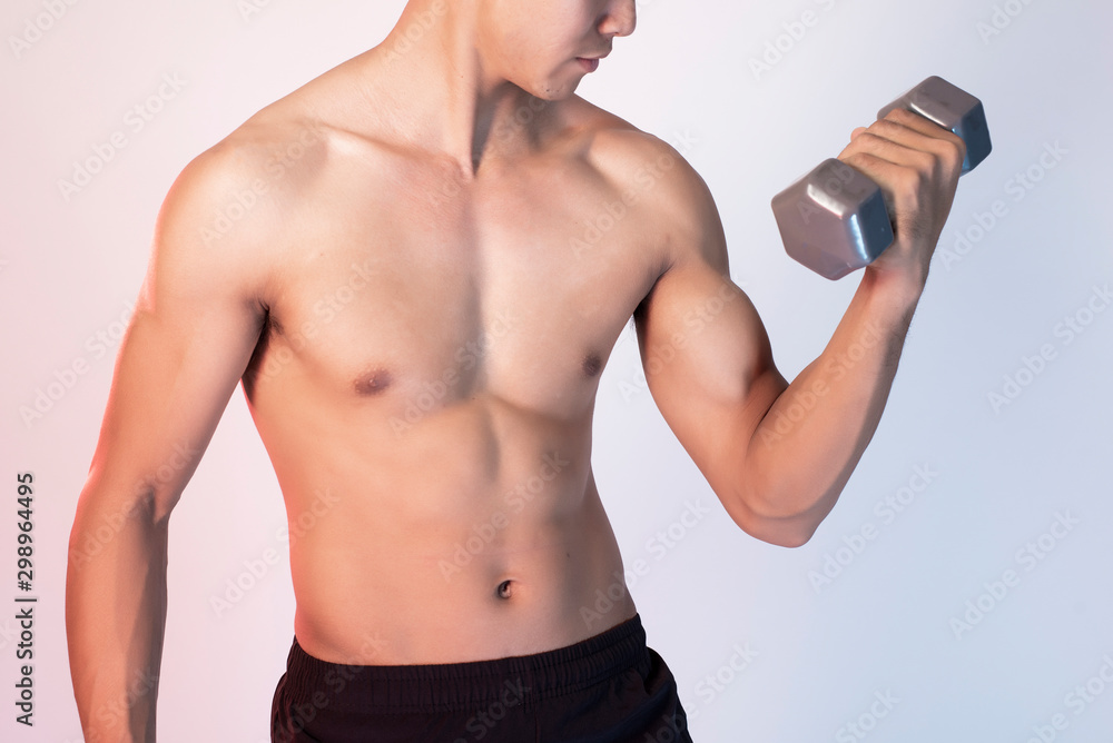 Fototapeta premium Handsome Muscular fitness man in studio