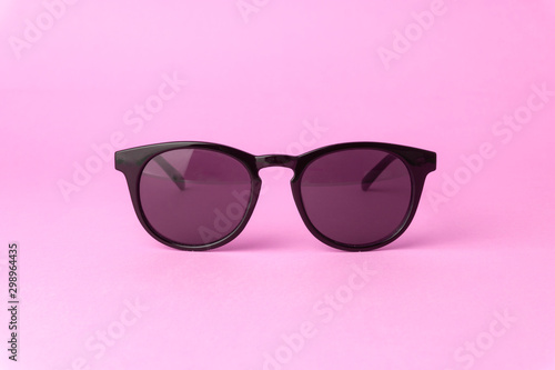 Pink vintage sunglasses on a pure pink background