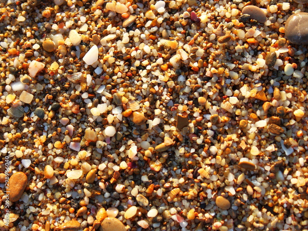 sand pebbles beach close-up texture background at sunset sand pebbles beach close-up texture background at sunset