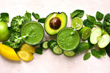 Green vegetable detox smoothie with ingredients for making. Top view with copy space.
