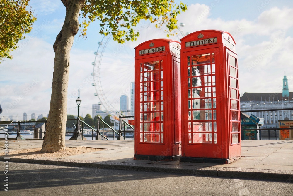 Two London Telephone Boxes on an Empty Street by the River Thames Two London Telephone Boxes on an Empty Street by the River Thames