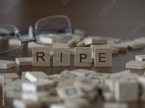 The concept of Ripe represented by wooden letter tiles photo