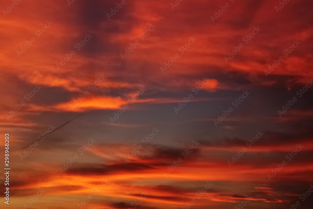 red orange blurred clouds at sunset texture background