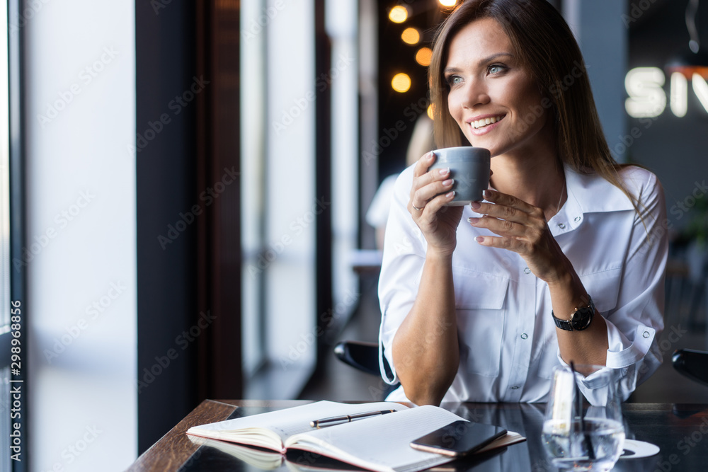 woman drinking coffee in the morning at restaurant woman drinking coffee in the morning at restaurant