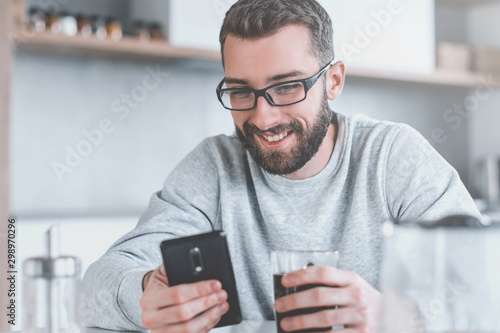 close up. man reading e-mails during Breakfast