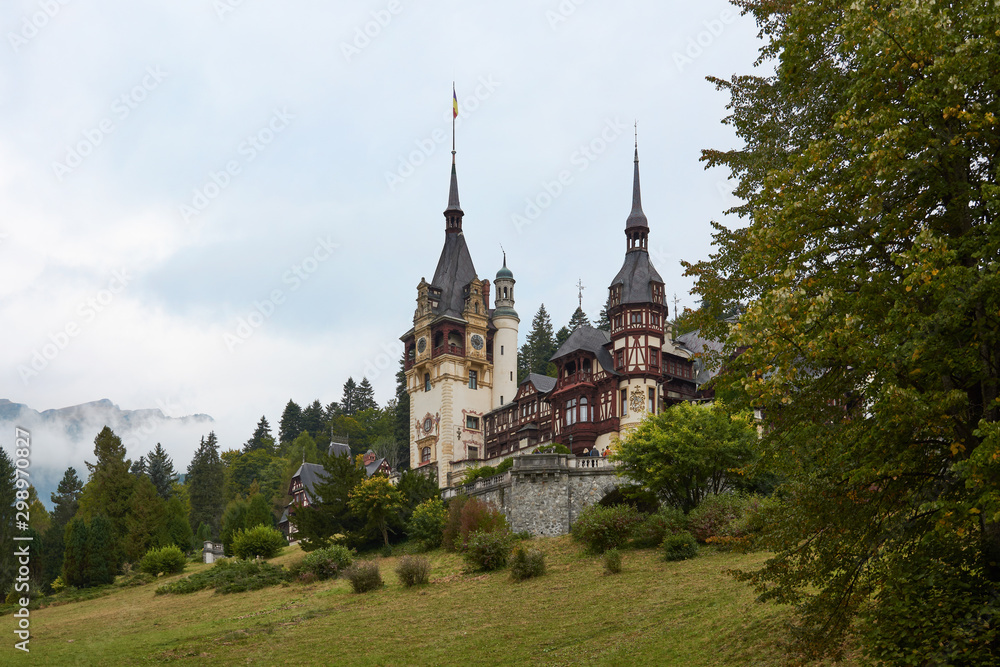Peles Castle, residence of King Charles I in Sinaia, Romania. Autumn landscape of royal palace and park.