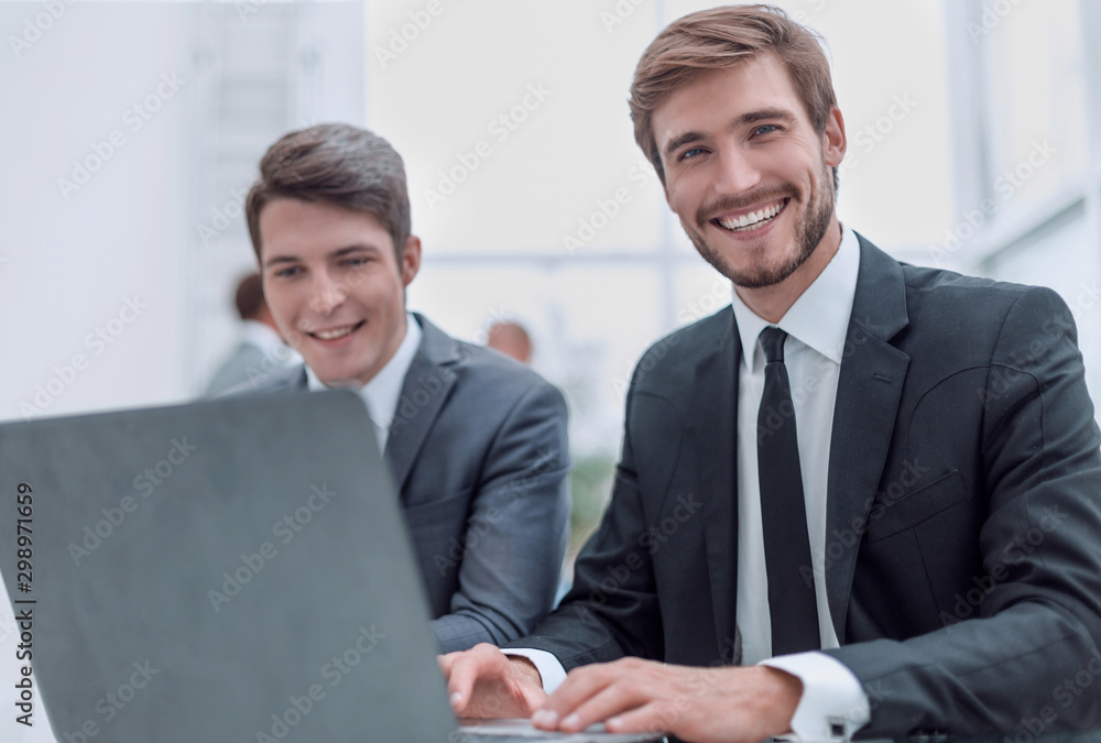 close up. two business men sitting at an office Desk close up. two business men sitting at an office Desk