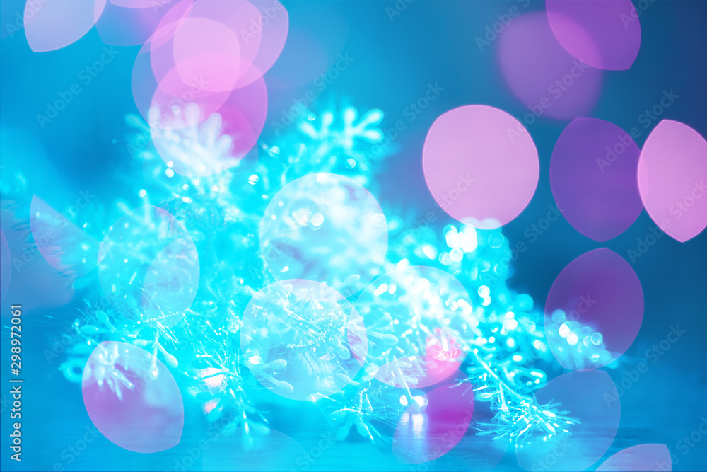 New Year's abstraction in the form of multi-colored bokeh on a blue background. Festive mood. New Year's abstraction in the form of multi-colored bokeh on a blue background. Festive mood.