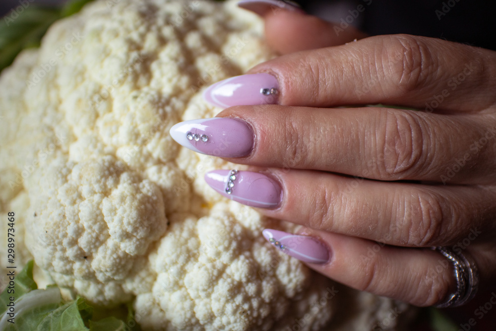 custom made wallpaper toronto digitalWomen's hands with manicured nails holds fresh organic cauliflower