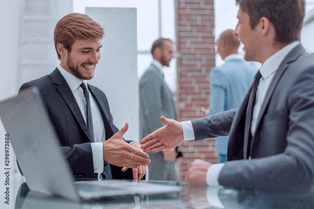 Fototapeta premium close up. business people holding out their hands for a handshake