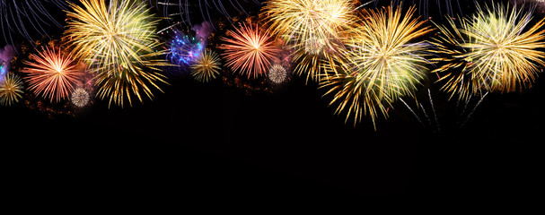 Fireworks explosions on black