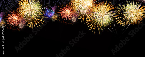 Fireworks explosions on black photo