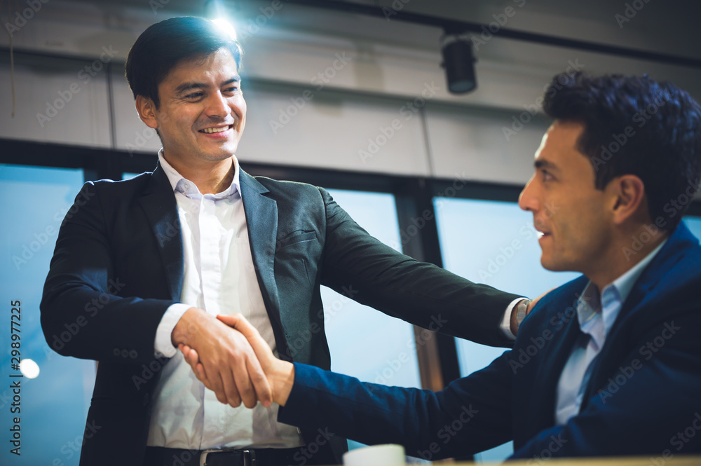Business people shake hands Symbols of business cooperation Business people shake hands Symbols of business cooperation