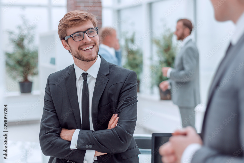 Fototapeta premium smiling business men talking to his colleague