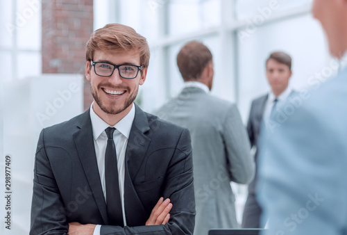 Wallpaper Mural smiling young businessman at the workplace office. Torontodigital.ca