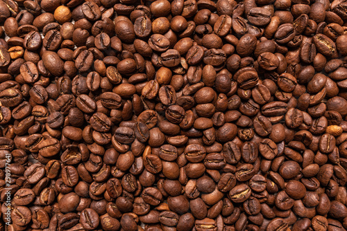 Black coffee beans closeup as a background.