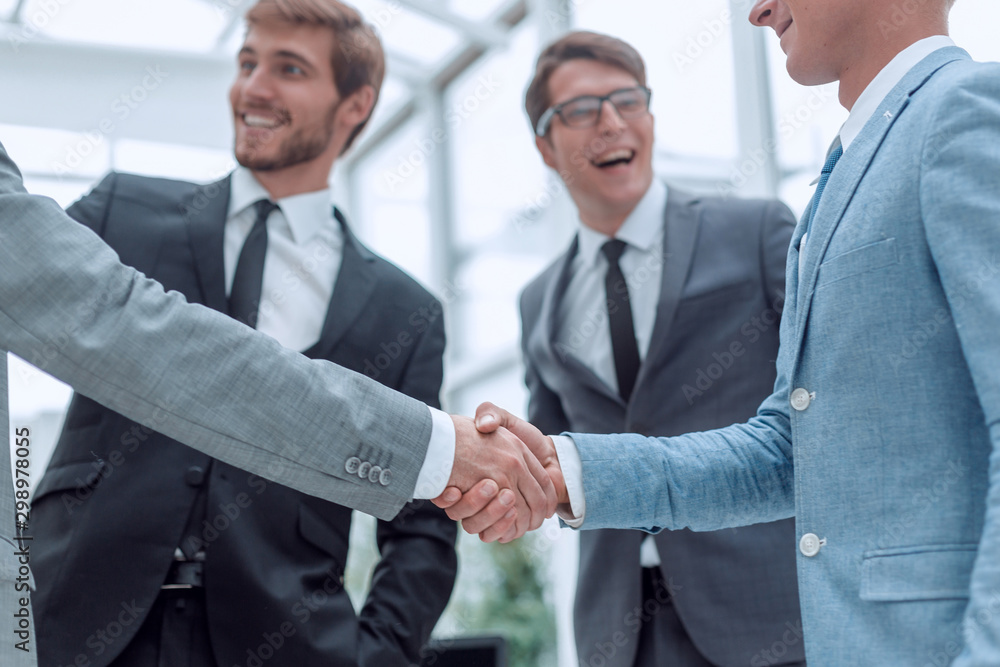 welcome handshake of business people in the office welcome handshake of business people in the office
