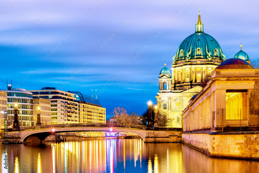 Berlin cathedral Berliner Dom in the evening twilight sunset with Spree river and reflections. Berlin, Germany.