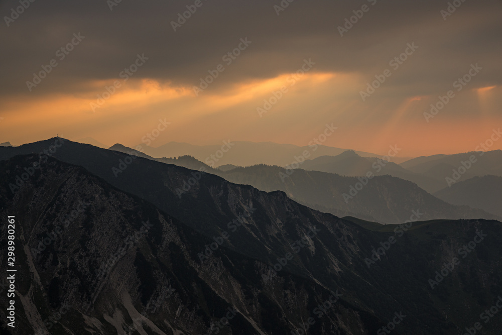 Sunset View in the austrian alps during summer on top of the mountains