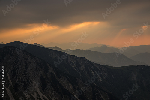 Sunset View in the austrian alps during summer on top of the mountains