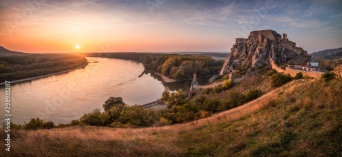 Famous Devin Castle Ruin Located at Confluence of Danube River and Morava River near Bratislava, Slovakia at Sunset