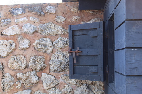 old wooden door in brick wall