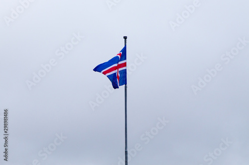 Iceland flag that waves over blue sky