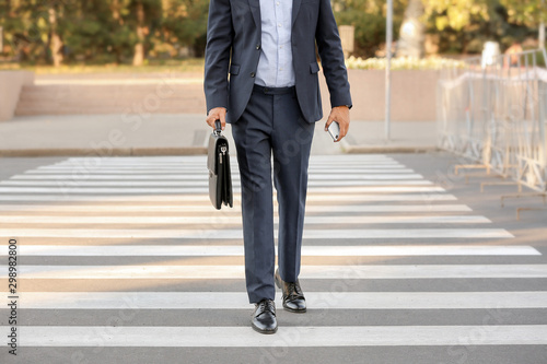 Wallpaper Mural Handsome businessman on pedestrian crosswalk Torontodigital.ca