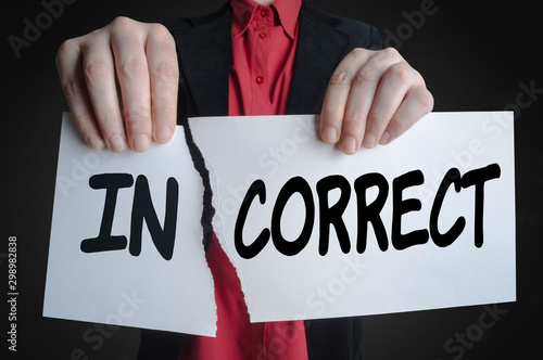 Businessman tearing up a paper sign, Incorrect become Correct.