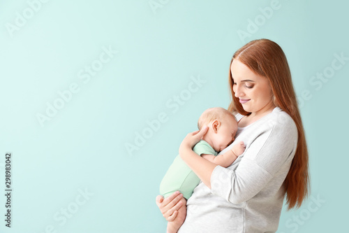 Mother with cute baby on co...