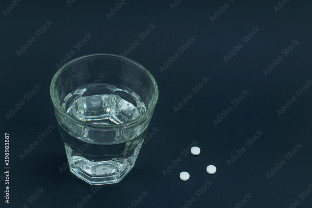 Glass of water with medications Glass of water with medications