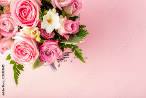 Beautiful and tender bouquet of flowers in the hat box,