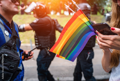 Hand hold a gay lgbt flag at LGBT gay pride parade festival