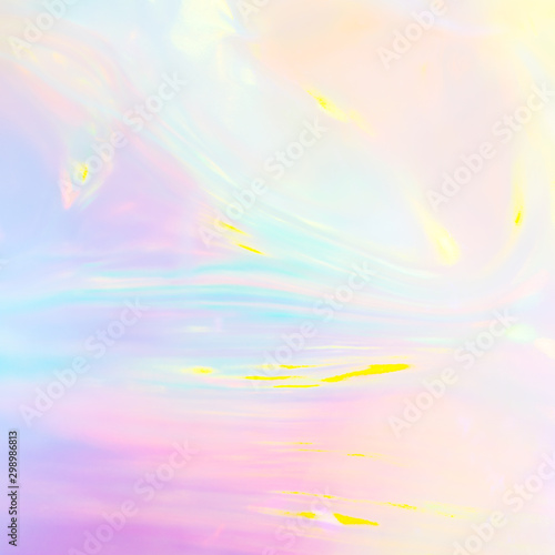 Abstract iridescent image of holographic plastic material in pastel colors