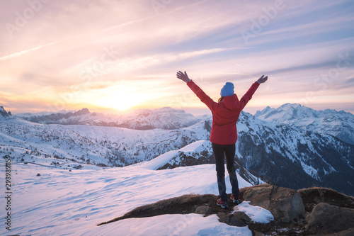 Happy young woman in snowy ...