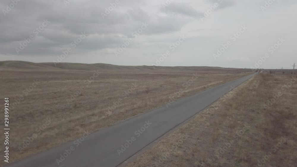 autumn auto road in the middle of the fields of Kazakhstan autumn auto road in the middle of the fields of Kazakhstan