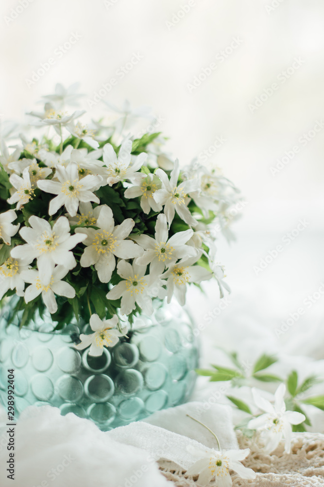 White flowers in a vase on a white background.