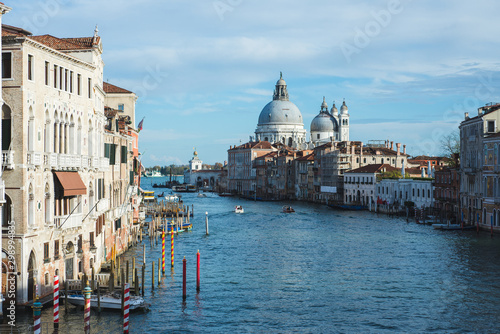View of Venice Grande Canal, boats and ships on the water with passengers.