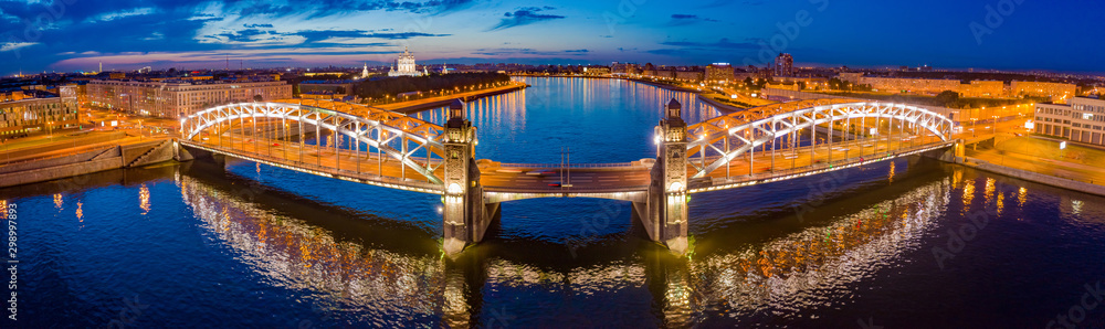 Saint-Petersburg. Russia. Panorama Bolsheokhtinsky bridge. Peter the Great bridge in the evening. Bridges Of St. Petersburg. Rivers Of St. Petersburg. Neva River. Reflections in the river.