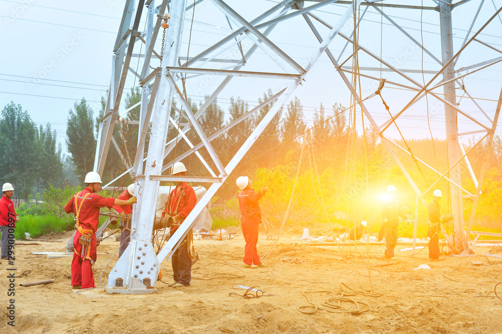 Fototapeta premium Pylon construction workers