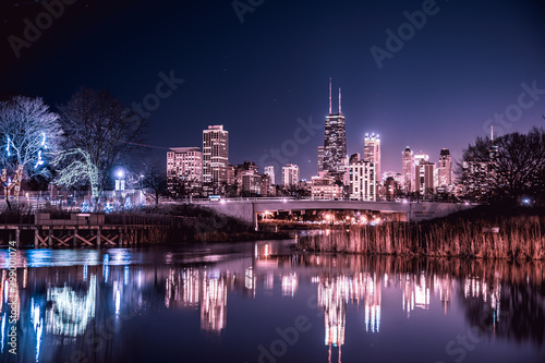 Chicago skyline lights during night time in the middle of winter.