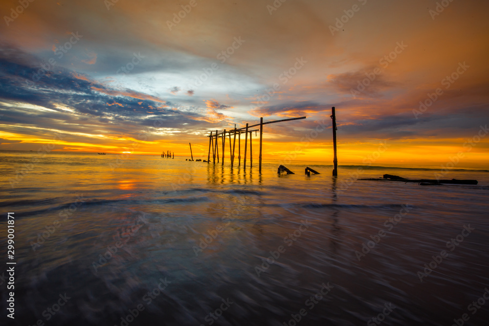 The blurry background of the colorful night sky on the large lake, the brightness of the light that hits the water surface and the wind blows cool, with the rotten wooden bridge over time, a viewpoint The blurry background of the colorful night sky on the large lake, the brightness of the light that hits the water surface and the wind blows cool, with the rotten wooden bridge over time, a viewpoint