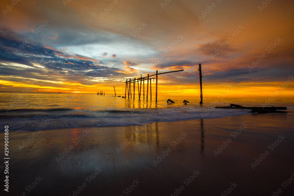 The blurry background of the colorful night sky on the large lake, the brightness of the light that hits the water surface and the wind blows cool, with the rotten wooden bridge over time, a viewpoint The blurry background of the colorful night sky on the large lake, the brightness of the light that hits the water surface and the wind blows cool, with the rotten wooden bridge over time, a viewpoint