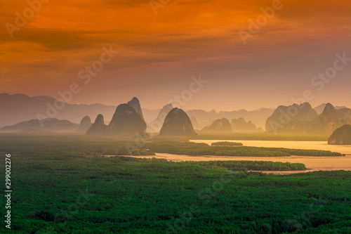 Panoramic nature background  mountains  sea  trees  twilight lights in the sky  waterfront communities   naturally blurred through the wind  seen on tourist spots or scenic spots