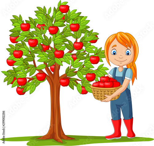Girl farmer gathering apples in basket